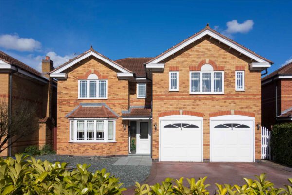 Double white garage doors on detached house 2 - JB Garage Doors