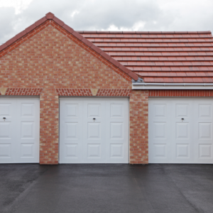 Triple white up & over garage doors - JB Garage Doors