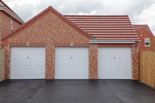 Triple white up & over garage doors - JB Garage Doors