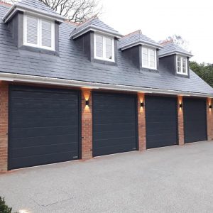 Quad grey sectional garage doors - JB Garage Doors