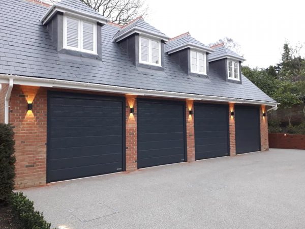 Quad grey sectional garage doors - JB Garage Doors