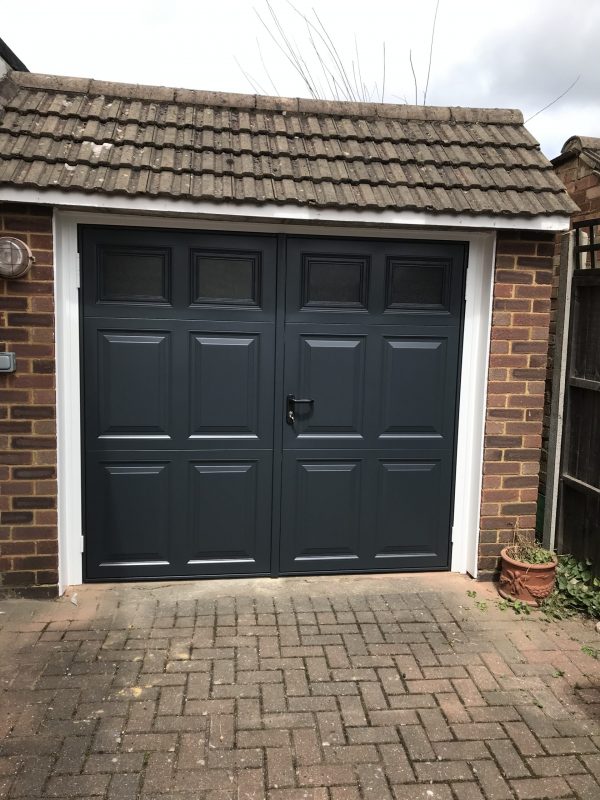 Single black garage door maintenance - JB Garage Doors