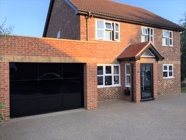 Single black garage door about us 2 - JB Garage Doors