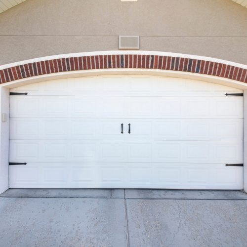 White side hinged garage door.