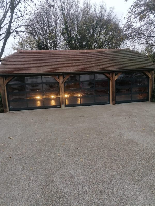 triple black sectional garage doors
