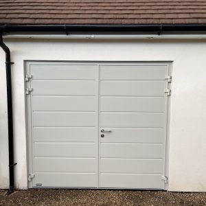 teal side-hinged garage doors