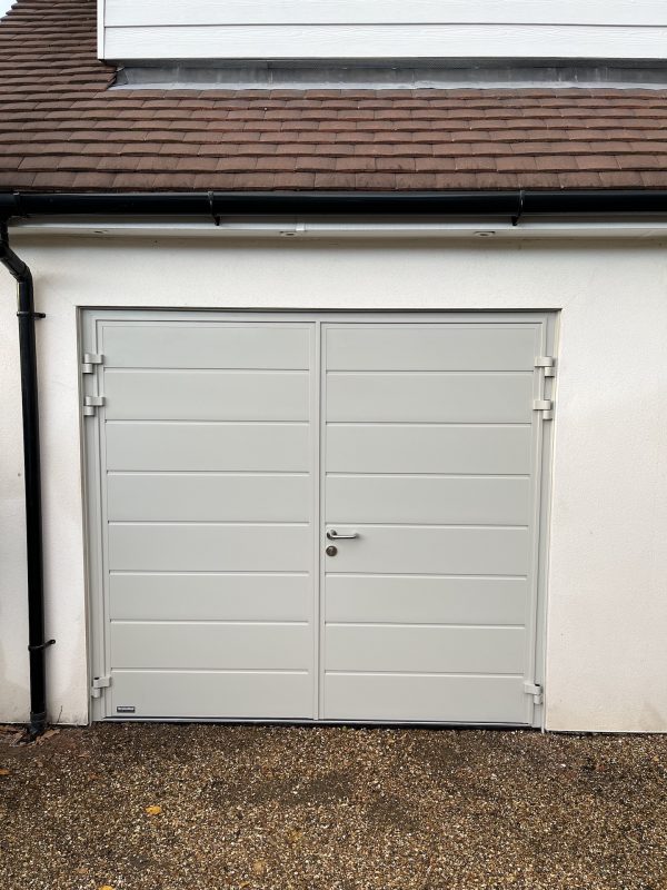 teal side-hinged garage doors