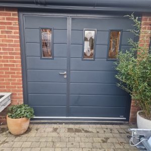 dark grey side-hinged garage door
