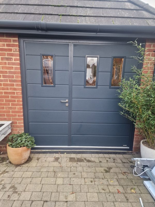 dark grey side-hinged garage door