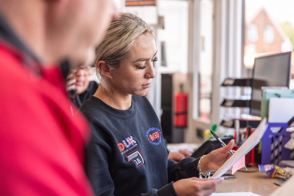 JB Garage Doors employee checking company order