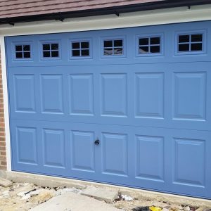 blue garage door with windows