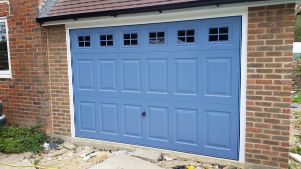 blue garage door with windows