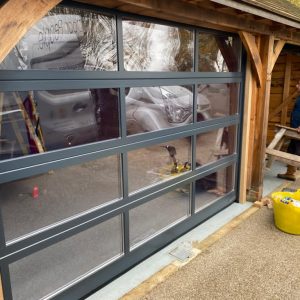 Glass garage door in Anthracite grey.