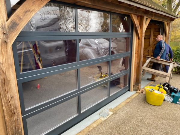 Glass garage door in Anthracite grey.