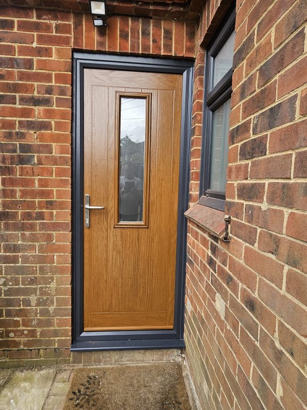 Composite front door with black frame.