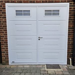 After installation of Teckentrup Georgian white side hinged garage door with windows.