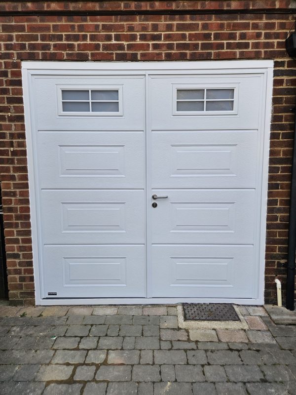 After installation of Teckentrup Georgian white side hinged garage door with windows.