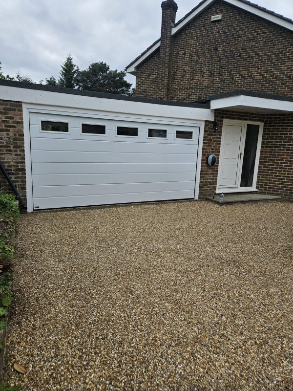 White matching garage door with windows.