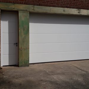 White garage door with side door.