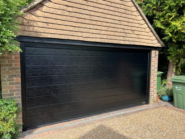 Hormann ribbed black garage door.