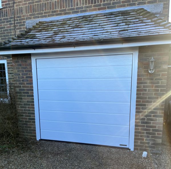 White Hormann LPU42 ribbed garage door.