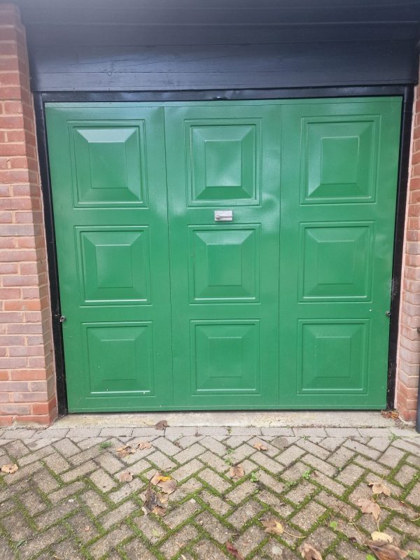 Before Moss green garage door installation.
