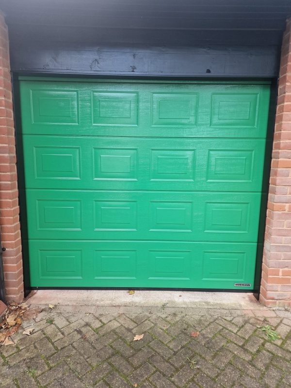 Green panelled garage door.