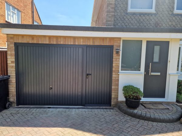 Installation of matching garage door and front door.