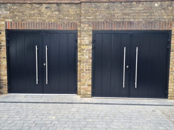 Two Teckentrup centre ribbed black side hinge doors.